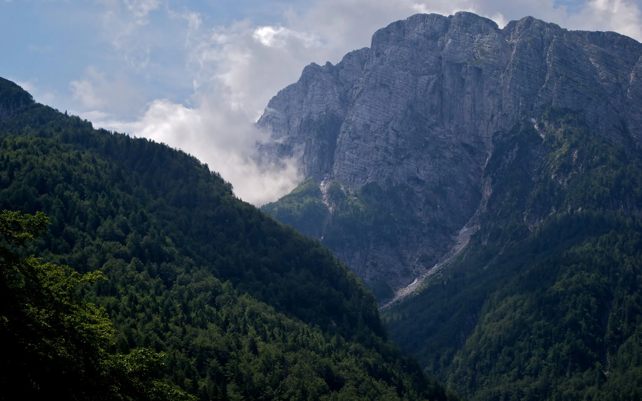 Photo of mountain with clouds over the mountains