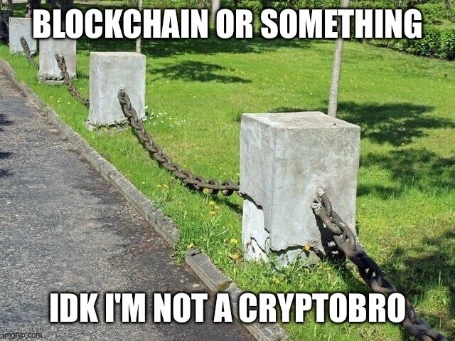 a photo of concrete blocks linked by metal chains on the side of a path, with the text "blockchain or something, idk i'm not a cryptobro"