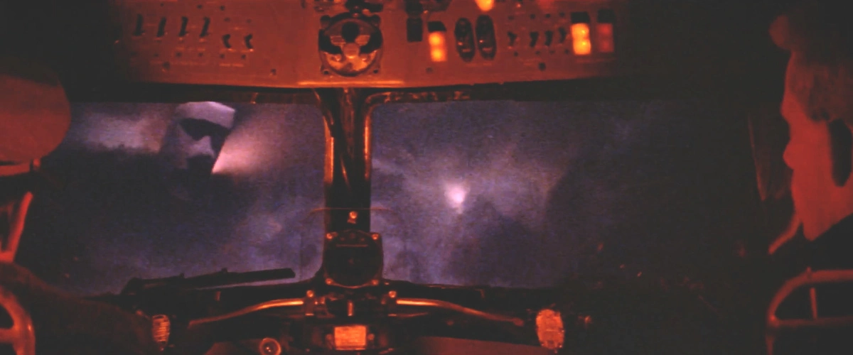 The view from the cockpit, showing an Easter island statue floating mid air