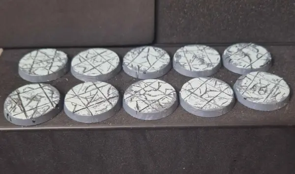 Ten 32mm bases made to look like cracked stone tiles. A little amateurish but OP thinks they're alright.