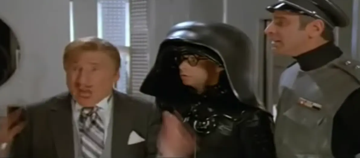 screenshot of the moment in the 1987 film Spaceballs when President Skroob (Mel Brooks) says "That's amazing! I've got the same combination on my luggage!". (no text)