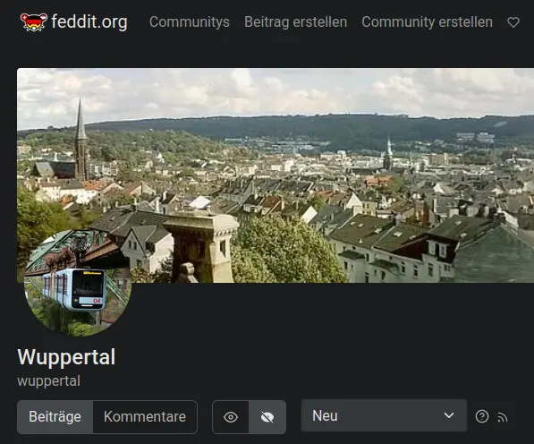 Startseite der Wuppertal-Community auf feddit.org - Bannerbild ist ein Stadtpanorama, Iconbild die Schwebebahn