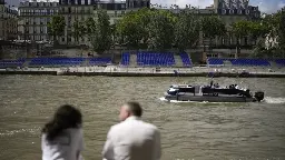 French sports minister takes symbolic dive into river Seine