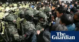 South Korea gripped by uncertainty as MPs defy president’s declaration of martial law