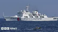 Chinese coast guard personnel armed with swords, spears and knives accused of ramming Filipino boats in disputed South China Sea