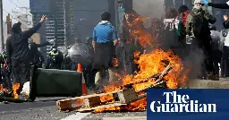 Dozens injured and 39 arrested in fiery confrontations between weapons expo protesters and police in Melbourne