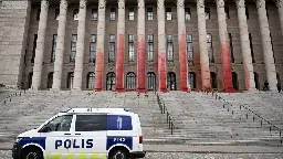 Environmentalists smear Finland's parliament in red paint