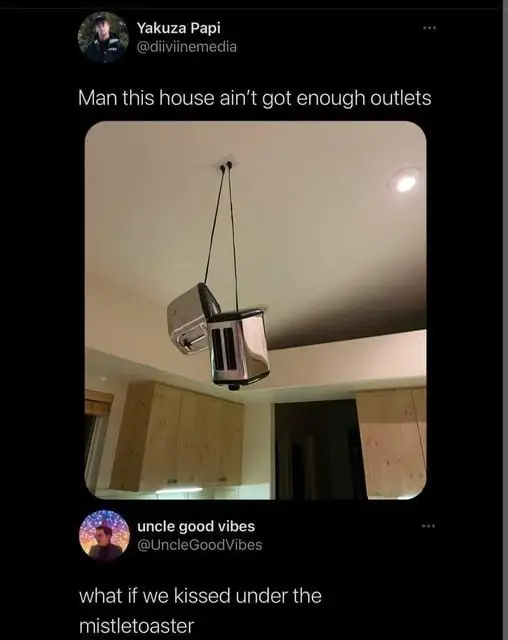 A microblog post by user Yakuza Papi @diviinemediaMan contains an image of two toasters hanging from their plugs, connected to a ceiling outlet. They say "this house ain't got enough outlets"A reply says, "what if we kissed under the mistletoaster"