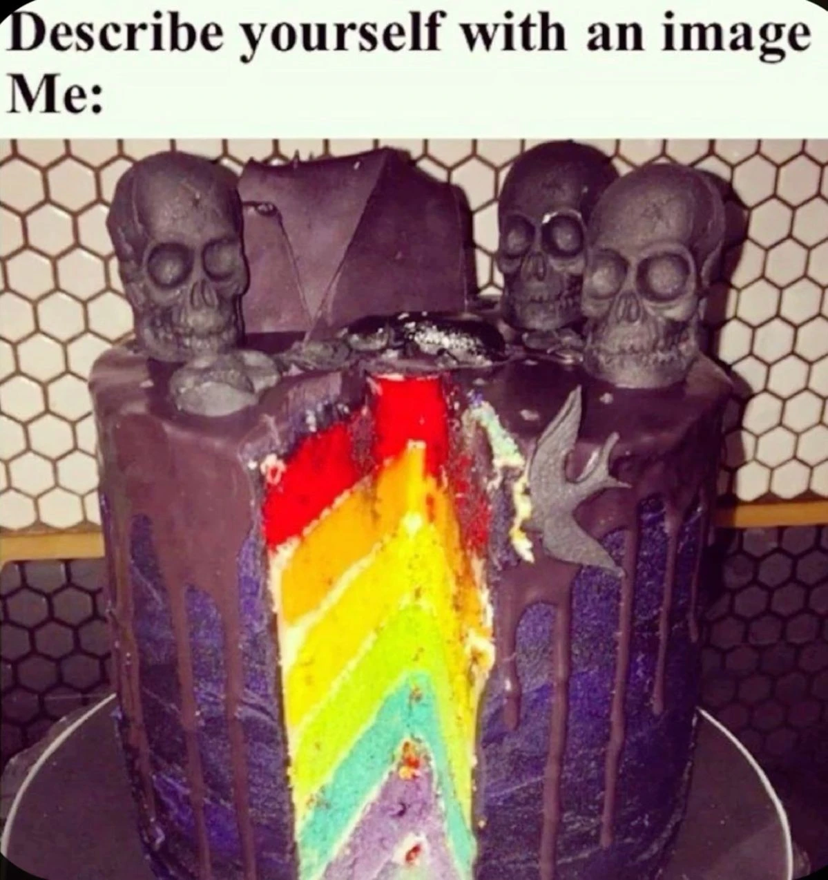 It's a cake decorated with a "goth theme" -- black frosting, black skulls, black birds -- but the inside of the cake is a 6 layer rainbow.