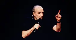 George Carlin’s Daughter Blasts Dudesy AI-Generated Comedy Special Impersonating Her Dad: “No Machine Will Ever Replace His Genius”